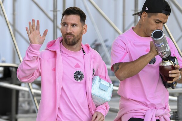 Inter Miami forward Lionel Messi, left, and forward Luis Suárez arrive before playing Nashville SC in a CONCACAF Champions Cup soccer match, Wednesday, March 13, 2024, in Fort Lauderdale, Fla. (AP Photo/Michael Laughlin)