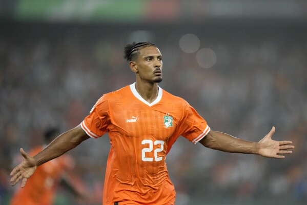 Ivory Coast's Sebastien Haller celebrates after scoring the opening goal during the African Cup of Nations semifinal soccer match between Ivory Coast and DR Congo, at the Olympic Stadium of Ebimpe in Abidjan, Ivory Coast, Wednesday, Feb. 7, 2024. (AP Photo/Sunday Alamba)