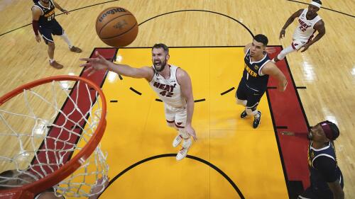 Miami Heat forward Kevin Love (42) shoots against the Denver Nuggets during the first half in Game 4 of the basketball NBA Finals, Friday, June 9, 2023, in Miami. (Kyle Terada/Pool Photo via AP)