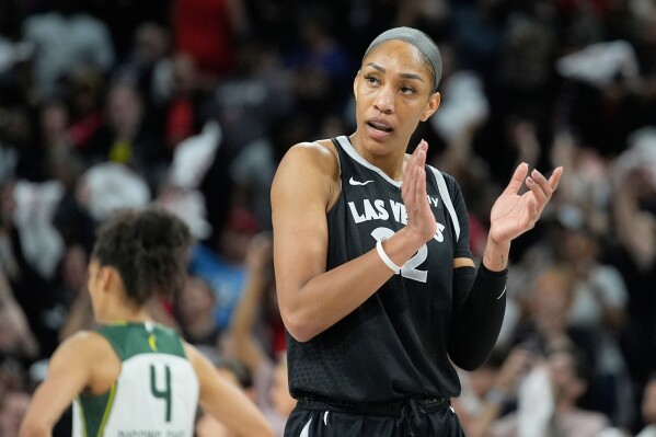 Las Vegas Aces center A'ja Wilson (22) plays against the Seattle Storm in Game 2 of a WNBA basketball first-round playoff game Tuesday, Sept. 24, 2024, in Las Vegas. (AP Photo/John Locher, File)