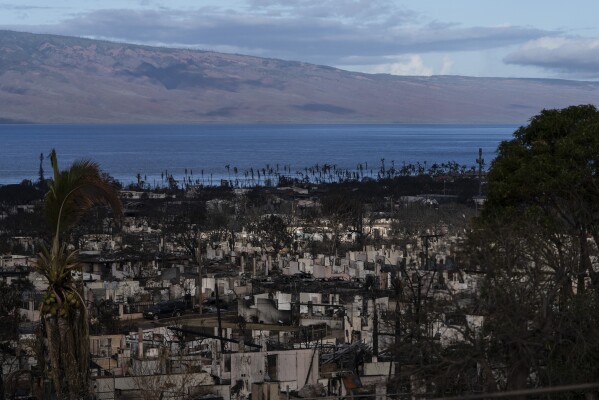 FILE - Homes consumed in recent wildfires are seen in Lahaina, Hawaii, on Aug. 16, 2023. Filipinos began arriving in Hawaii more than a century ago, lured by promises of work on sugarcane and pineapple plantations to support their families back home. Many of those who perished or lost homes in the August 2023 fire were of Filipino descent, a labor force vital to Maui's tourist industry. (AP Photo/Jae C. Hong, File)