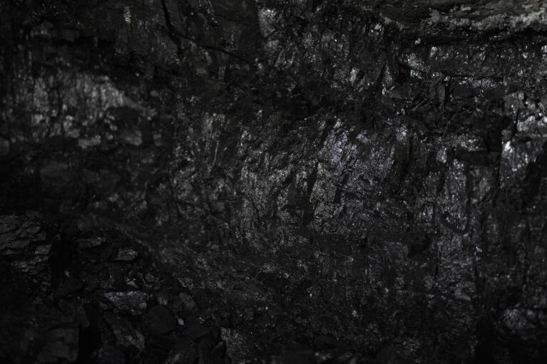 A wall of coal is visible at the bottom of the Gruve 7 coal mine in Adventdalen, Norway, Monday, Jan. 9, 2023. Gruve 7, the last Norwegian mine in one of the fastest warming places on earth, was scheduled to shut down this year and only got a reprieve through 2025 because of the energy crisis driven by the war in Ukraine. (AP Photo/Daniel Cole)
