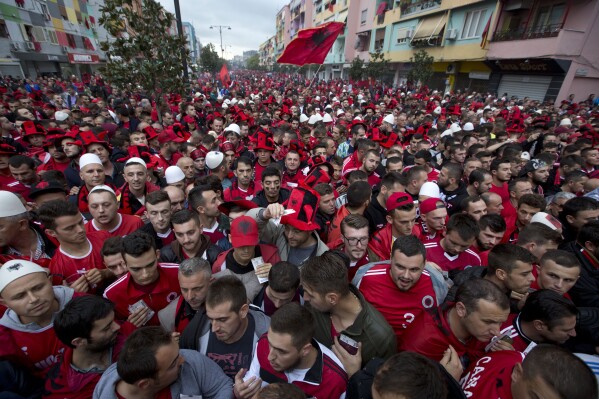Albania fans wait to be searched by police before the Group I Euro 2016 qualifying match between Albania and Serbia in Elbasan, central Albania, Oct. 8, 2015. (AP Photo/Visar Kryeziu, File)