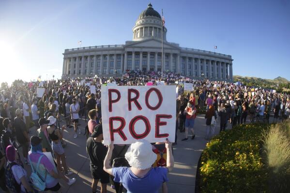 FILE - People attend an abortion-rights rally at the Utah State Capitol in Salt Lake City after the U.S. Supreme Court overturned Roe v. Wade, June 24, 2022. A Utah court on Friday, April 28, 2023, will consider a request from Planned Parenthood to delay implementing a statewide ban on abortion clinics set to begin taking effect next week. The organization in a motion filed earlier this month argued a state law passed earlier this year will severely curtail access to abortion in Utah. (AP Photo/Rick Bowmer, File)