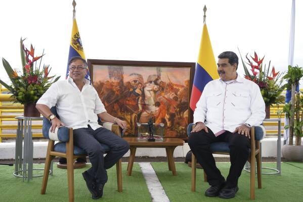 In this photo released by the Colombian Presidential Press Office, Colombia's President Gustavo Petro, left, and Venezuela's President Nicolas Maduro, right, meet before signing a bilateral agreements at the International Bridge Atanasio Girardot, on the border between Venezuela and Colombia, Thursday, Feb.16, 2023. (Juan Cano/Colombian Presidential Press Office via AP)