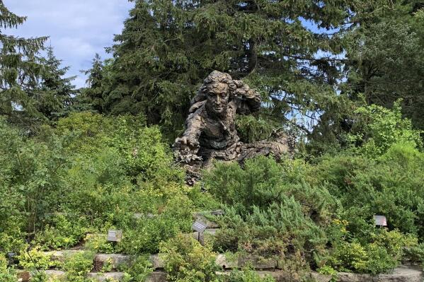 A sculpture of Swedish botanist, zoologist and physician Carl Linnaeus stands in the Heritage Garden of the Chicago Botanic Garden, in Glencoe, Ill. Linnaeus created rules for classifying and naming plants. (AP Photo/Julia Rubin)
