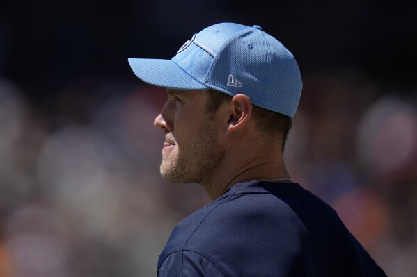 Tennessee Titans quarterback Ryan Tannehill watches from the sidelines during the second half of an NFL preseason football game against the Chicago Bears, Saturday, Aug. 12, 2023, in Chicago. (AP Photo/Erin Hooley)