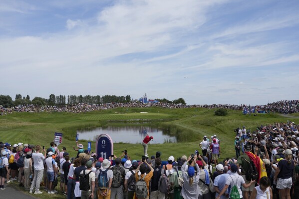 Jon Rahm, of Spain, plays off the 11th tee during the final round of the men's golf at the 2024 Summer Olympics, Sunday, Aug. 4, 2024, at Le Golf National in Saint-Quentin-en-Yvelines, France. (AP Photo/Matt York)