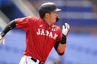 FILE - Japan's Seiya Suzuki plays during a baseball game at Yokohama Baseball Stadium during the 2020 Summer Olympics, Saturday, July 31, 2021, in Yokohama, Japan. The Chicago Cubs and star Japanese outfielder Seiya Suzuki have agreed to an $85-million, five-year contract, a person familiar with the situation told The Associated Press on Wednesday, March 16, 2022. (AP Photo/Matt Slocum, File)