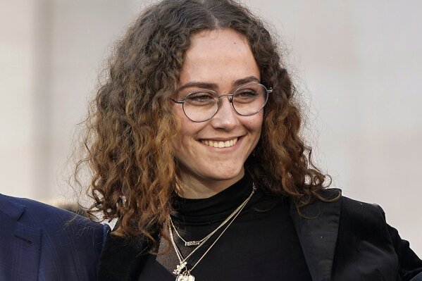 FILE -Ella Emhoff appears at a rally for her stepmother Sen. Kamala Harris, announcing Harris' presidential campaign in Oakland, Calif., Sunday, Jan. 27, 2019. The designers at Proenza Schouler dressed Ella Emhoff in a couple of coats (plus a pantsuit) for her modeling debut in their new collection, unveiled Thursday for New York Fashion Week. Designers Lazaro Hernandez and Jack McCollough said the fashion world took quick notice when 21-year-old Emhoff appeared at the inauguration in January, dressed in a quirky Miu Miu coat with bejeweled shoulders along with a starchy white collar. (AP Photo/Tony Avelar, File)