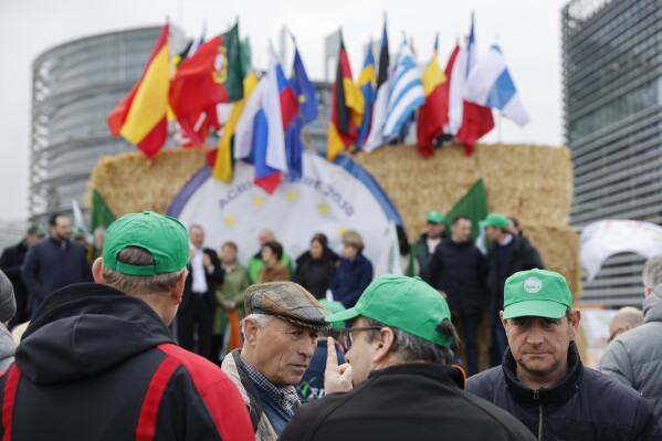 Farmers gather Tuesday, March 12, 2024 outside the European Parliament in Strasbourg, eastern France. For several months, farmers throughout Europe have been mobilizing to address local, national, and European concerns (AP Photo/Jean-Francois Badias)
