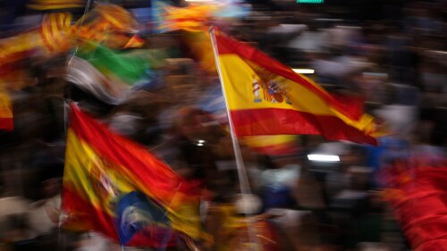 Supporters of Spain's mainstream conservative Popular Party supporters wave flags while waiting for its leader Alberto Feijoo to address them following Spain's general election, in Madrid, Sunday, July 23, 2023. Spain's conservative Popular Party is set to narrowly win the country's national election but without the majority needed to topple the coalition government of Socialist Prime Minister Pedro Sánchez. (AP Photo/Manu Fernandez)