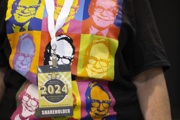 Shareholder Tina Schmidt of Cozad, Neb., wears a shirt with Warren Buffett's portrait in the style of an Andy Warhol painting at he Berkshire Hathaway annual meeting on Saturday, May 4, 2024, in Omaha, Neb. (AP Photo/Rebecca S. Gratz)