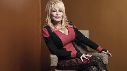 FILE - Dolly Parton poses at the Carnegie Medal of Philanthropy Ceremony in New York on Oct. 13, 2022. Parton will close out the awards show with her performance of “World On Fire,” from her record “Rock Star.” The ACMs will air on May 11 on Prime Video live from Frisco, Texas. (AP Photo/Andres Kudacki, File)
