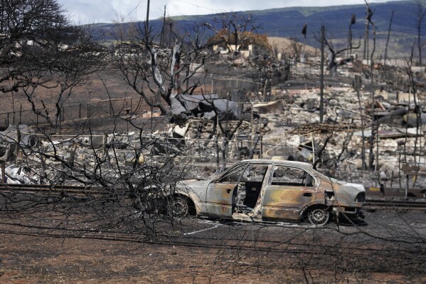Destroyed property is seen, Sunday, Aug. 13, 2023, in Lahaina, Hawaii, following a deadly wildfire that caused heavy damage days earlier. (AP Photo/Rick Bowmer)