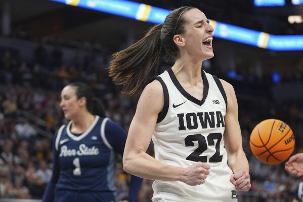 Iowa guard Caitlin Clark (22) celebrates after making a basket while fouled during the second half of an NCAA college basketball quarterfinal game against Penn State at the Big Ten women's tournament Friday, March 8, 2024, in Minneapolis. (AP Photo/Abbie Parr)