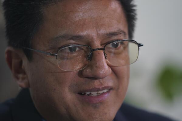 Jorge Atilano Gonzalez Candia, priest and advisor with the Roman Catholic Society of Jesus who was assigned to the case of two slain Jesuit priests in Mexico, gives an interview at his office in Mexico City, Thursday, Sept. 1, 2022. Gonzalez said that investigation, change to local structures and political will are needed to make the changes that will generate peace. (AP Photo/Fernando Llano)