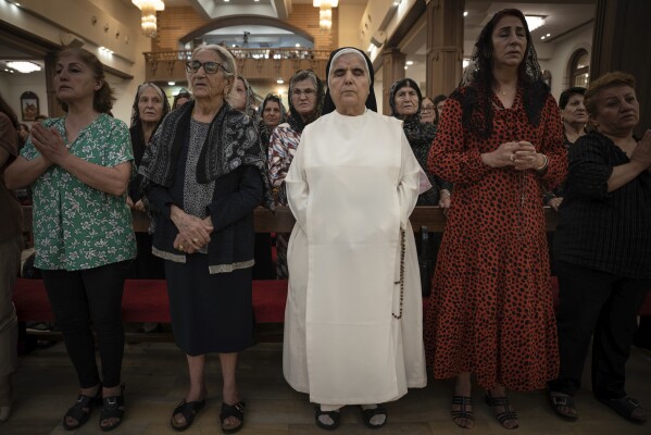 Chaldean Christians attend a service in the Mar Youssef Cathedral in Irbil, Iraq, on Sunday, July 30, 2023. Today, the number of Christians in Iraq is 150,000, compared to 1.5 million in 2003. (AP Photo/Julia Zimmermann/Metrography)
