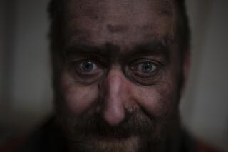 Coal miner Jonny Sandvoll poses for a portrait in the break room of the Gruve 7 coal mine in Adventdalen, Norway, Monday, Jan. 9, 2023. Gruve 7, the last Norwegian mine in one of the fastest warming places on earth, was scheduled to shut down this year and only got a reprieve through 2025 because of the energy crisis driven by the war in Ukraine. Sandvoll said he wished people understood more about coal and its uses before deciding to close the mine. (AP Photo/Daniel Cole)