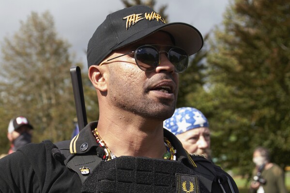 FILE - Proud Boys leader Enrique Tarrio speaks at a rally in Delta Park on Sept. 26, 2020, in Portland, Ore. (AP Photo/Allison Dinner, File)