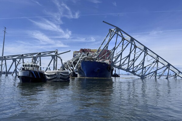The fallen Francis Scott Key Bridge in Baltimore is pictured March 31, 2024, where divers assisted crews with the complicated and meticulous operation of removing steel and concrete. (AP Photos/Mike Pesoli, file)