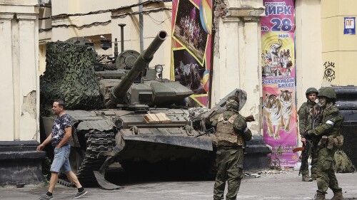 ON HOLD TO GO WITH RUSSIA BELARUS WAGNER STORY FILE Members of the Wagner Group military company guard an area standing in front of a tank in a street in Rostov-on-Don, Russia, Saturday, June 24, 2023. Following an armed rebellion by a mercenary group in Russia, tensions are rising in and around neighboring Belarus, where the exiled leader of the force and some of its fighters are settling in. While authoritarian President Alexander Lukashenko has offered them refuge, that isn't sitting well with the Belarusian opposition and guerrilla activists, who call Wagner fighters a threat to the country. (Vasily Deryugin, Kommersant Publishing House via AP, File)