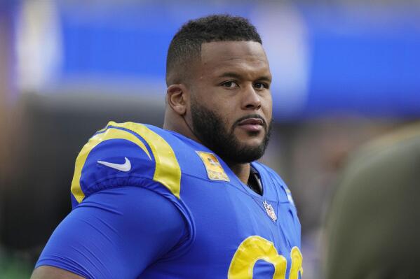 FILE - Los Angeles Rams defensive tackle Aaron Donald looks on from the bench during the first half of an NFL football game against the Arizona Cardinals on Nov. 13, 2022, in Inglewood, Calif. Donald is unlikely to return to the Los Angeles Rams' defense this season, coach Sean McVay says. Donald will miss his fourth straight game with a high ankle sprain Sunday, Dec. 25, when the Rams (4-10) host the Denver Broncos. (AP Photo/Mark J. Terrill, File)