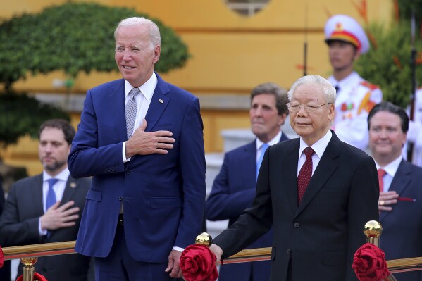 Vietnamese General Secretary of the Communist Party Nguyen Phu Trong, front right, and US President Joe Biden, front left, attend a military welcome ceremony at the Presidential Palace in Hanoi, Vietnam, Sunday, Sept.10, 2023. Biden is on an official two-day visit in Vietnam. (Luong Thai Linh/Pool Photo via AP)