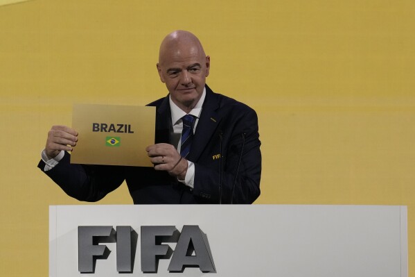 FIFA President Gianni Infantino announces that Brazil is chosen to host soccer's 2027 Women's World Cup at the FIFA Congress in Bangkok, Thailand, Friday, May 17, 2024.(AP Photo/Sakchai Lalit)