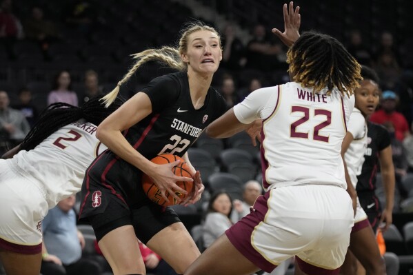 Stanford forward Cameron Brink, left, battles for the ball with Florida State forward Sakyia White, right, during the first half of an NCAA college basketball game Friday, Nov. 24, 2023, in Henderson, Nev. (AP Photo/John Locher)