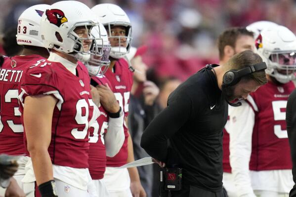 Arizona Cardinals head coach Kliff Kingsbury looks down during the second half of an NFL football game against the Los Angeles Chargers, Sunday, Nov. 27, 2022, in Glendale, Ariz. The Chargers defeated the Cardinals 25-24. (AP Photo/Ross D. Franklin)