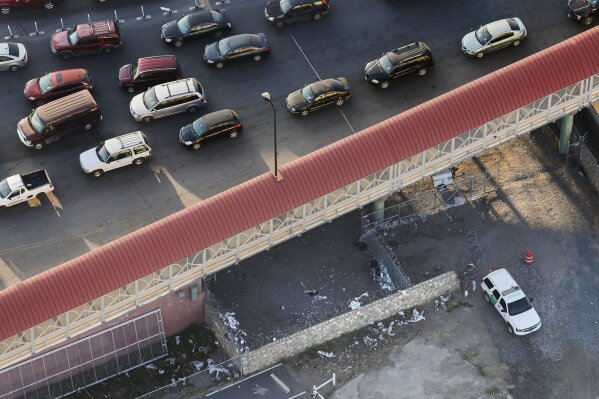 
              Shreds of Mylar blankets and a Border Patrol vehicle are seen under the Paso del Norte Port of Entry bridge in El Paso, Texas, on Sunday, March 31, 2019. Migrants, including young children and babies, seeking asylum were being kept in a U.S. Border Patrol temporary holding area under the bridge. Some migrants were held there for as many as four days and were forced to sleep outside on gravel, provided only thin Mylar blankets for warmth. (Ryan Michalesko/The Dallas Morning News via AP)
            