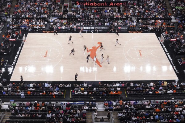 FILE - The Chicago Sky take on the Minnesota Lynx in a WNBA preseason basketball game in Toronto Saturday May 13, 2023. The WNBA is heading to Toronto, according to media reports. The Canadian Broadcasting Corporation reported that the women’s professional basketball league has awarded a franchise to the Kilmer Group. The reported deal would have Toronto’s WNBA team start playing in May 2026. (Chris Young/The Canadian Press via AP, File)