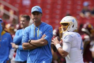 Los Angeles Chargers head coach Brandon Staley walking on the field during pregame warmups prior to the start of the first half of an NFL football game against the Washington Football Team, Sunday, Sept. 12, 2021, in Landover, Md. (AP Photo/Alex Brandon)
