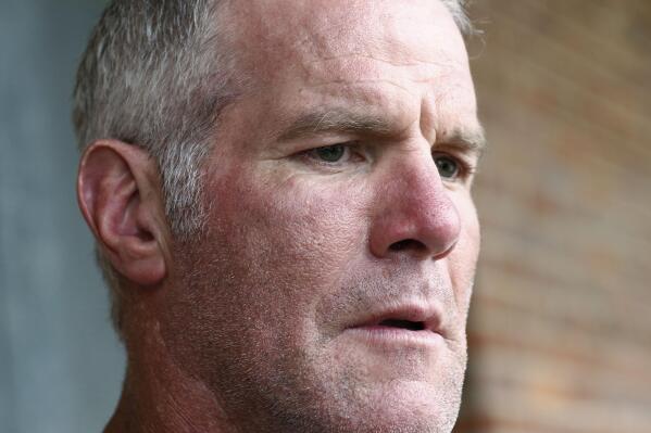 FILE - Former NFL quarterback Brett Favre speaks to the media in Jackson, Miss., Oct. 17, 2018. On Monday, May 9, 2022, the Mississippi Department of Human Services sued Favre, three former pro wrestlers and several other people and businesses to try to recover millions of misspent welfare dollars that were intended to help some of the poorest people in the U.S. (AP Photo/Rogelio V. Solis, File)