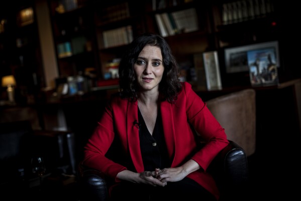 FILE - Isabel Diaz Ayuso speaks during an interview with The Associated Press in Madrid, Spain, April 26, 2021. A Spanish judge has opened an investigation for alleged fraud and false documentation against the sentimental partner of Madrid's powerful rightwing regional president, Isabel Diaz Ayuso. Ayuso, who is seen as a possible future party leader and prime minister candidate, has come under fire in recent months on several fronts but news reports of treasury investigations into alleged tax fraud by her partner has led opposition parties to call for her immediate resignation. (AP Photo/Bernat Armangue, File)