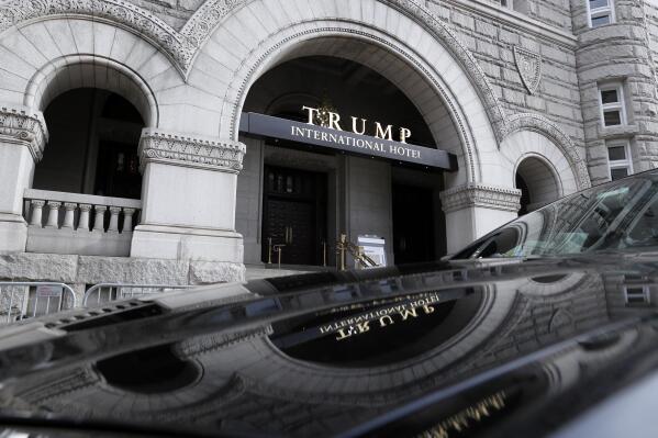 In this photo taken Dec. 21, 2016, the Trump International Hotel in Washington. Trump's $200 million hotel inside the federally owned Old Post Office building has become the place to see, be seen, drink, network, even live, for the still-emerging Trump set. It's a rich environment for lobbyists and anyone hoping to rub elbows with Trump-related politicos, despite the veil of ethics questions that hangs overhead. (AP Photo/Alex Brandon)