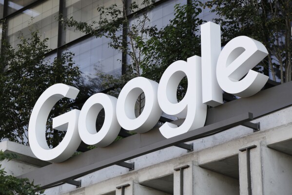 File - The Google sign is shown over an entrance to the company's new building in New York on Sept. 6, 2023. A federal court jury has decided that Google's Android app store has been protected by anticompetitive barriers that have damaged smartphone consumers and software developers, dealing a blow to a major pillar of a technology empire. (AP Photo/Peter Morgan, File)