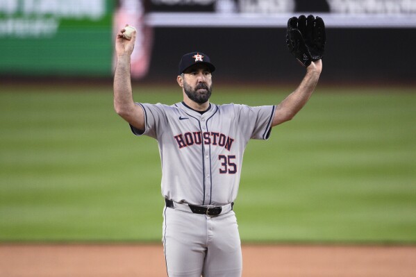 Houston Astros starting pitcher Justin Verlander asks for a new ball during the second inning of the team's baseball game against the Washington Nationals, Friday, April 19, 2024, in Washington. (AP Photo/Nick Wass)