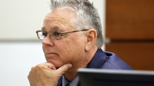 Former Marjory Stoneman Douglas High School School Resource Officer Scot Peterson sits at the defense table during his trial at the Broward County Courthouse in Fort Lauderdale, Fla, on Thursday, June 22, 2023. Broward County prosecutors charged Peterson, a former Broward Sheriff's Office deputy, with criminal charges for failing to enter the 1200 Building at the school and confront the shooter as he perpetuated the Valentine's Day 2018 mass shooting there. (Amy Beth Bennett/South Florida Sun-Sentinel via AP, Pool)