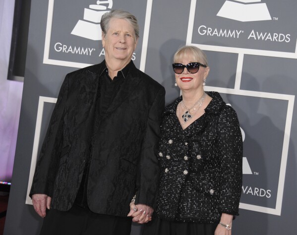 Musician Brian Wilson, left, and his wife Melinda Ledbetter Wilson arrive at the 55th annual Grammy Awards on Sunday, Feb. 10, 2013, in Los Angeles. (Photo by Jordan Strauss/Invision/AP, File)