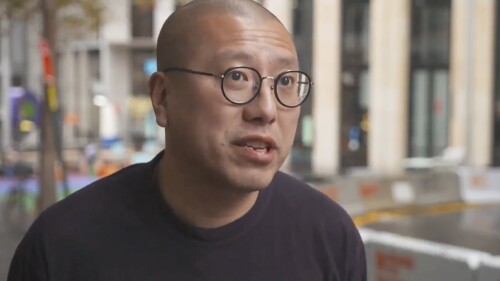 In this image made from video provided by AuBC, Kevin Yam, Australian pro-democracy lawyer and activist, speaks during an interview in Sydney, Tuesday, July 4, 2023. Hong Kong's Chief Executive John Lee said Tuesday that eight pro-democracy activists including Kevin Yam will be pursued for life for alleged national security offenses, dismissing criticism that the move to have them arrested was a dangerous precedent. Those former pro-democracy lawmakers now live in the United States, Britain, Canada and Australia. (AuBC via AP)