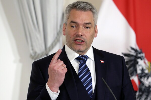 FILE - Austrian Chancellor Karl Nehammer briefs the media during a meeting with Netherlands Prime Minister Mark Rutte in Vienna, Austria, on Jan. 26, 2023. Austria's leader is proposing to enshrine in the country’s constitution a right to use cash, which remains more popular in the Alpine nation than in many other places. Nehammer said in a statement on Friday Aug. 4, 2023 that “more and more people are concerned that cash could be restricted as a means of payment in Austria.” (AP Photo/Heinz-Peter Bader, File)