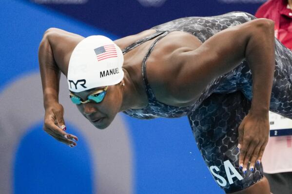 Simone Manuel, of United States, swims in a women's 50-meter freestyle heat at the 2020 Summer Olympics, Friday, July 30, 2021, in Tokyo, Japan. (AP Photo/Gregory Bull)