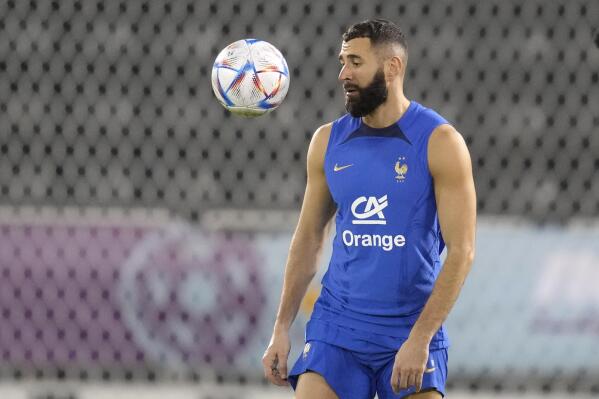 France's Karim Benzema eyes the ball during a training session at the Jassim Bin Hamad stadium in Doha, Qatar, Saturday, Nov. 19, 2022. France will play their first match in the World Cup against Australia on Nov. 22. (AP Photo/Christophe Ena)