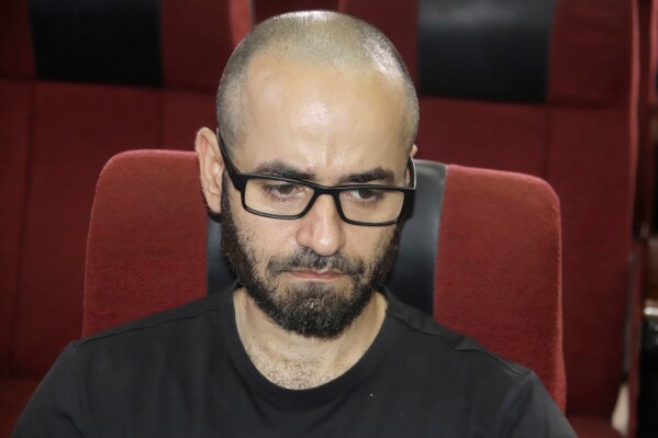 Tigran Gambaryan, an American citizen and Binance's head of financial crime compliance, attends a court hearing at the federal High Courts, in Abuja, Nigeria, Thursday, April 4, 2024. Nigerian authorities have asked a local court to prosecute Binance and two of its executives for alleged money laundering and tax evasion. The request was made on Thursday at the high court in the capital of Abuja where one of the executives, Gambaryan, was produced in court while the second remains at large after recently fleeing custody. (AP Photo/Olamikan Gbemiga )