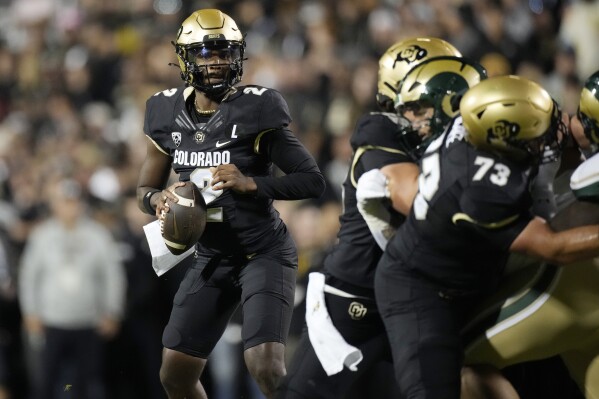 Colorado quarterback Shedeur Sanders (2) looks to pass the ball during the first half of an NCAA college football game against Colorado State, Saturday, Sept. 16, 2023, in Boulder, Colo. (AP Photo/David Zalubowski)