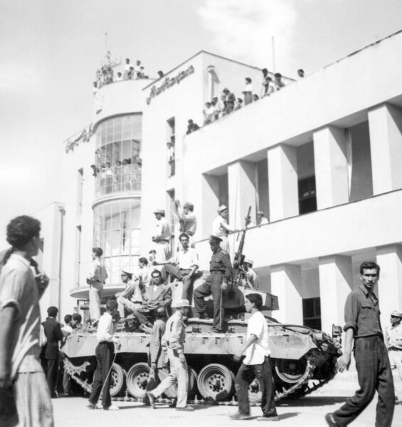 FILE -A royalist tank moves into the courtyard of Tehran Radio a few minutes after pro-shah troops occupied the area during the coup which ousted Mohammad Mosaddegh and his government on Aug. 19, 1953. In August 1953, a CIA-backed coup toppled Iran's prime minister, cementing the rule of Shah Mohammad Reza Pahlavi for over 25 years before the 1979 Islamic Revolution. (AP Photo, File)