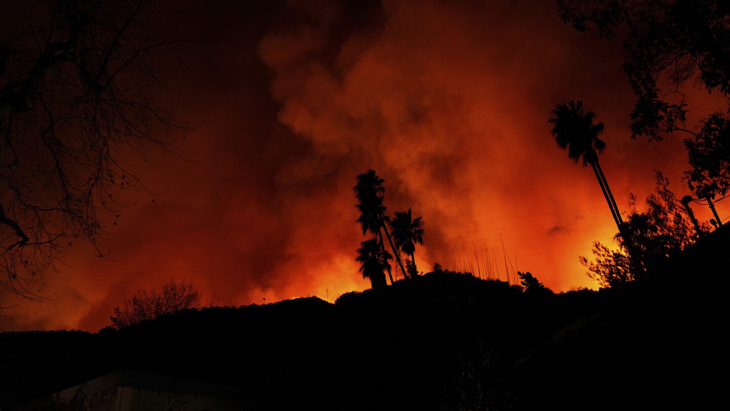 Los Angeles wildfires burn at least 10,000 structures as new blaze spreads