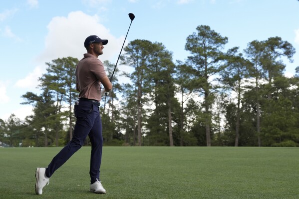 Wyndham Clark hits from the fairway on the second hole during the first round at the Masters golf tournament at Augusta National Golf Club Thursday, April 11, 2024, in Augusta, Ga. (AP Photo/Ashley Landis)